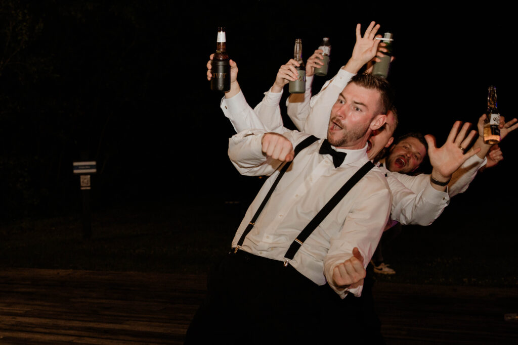 groomsmen doing train dance at moncks corner wedding